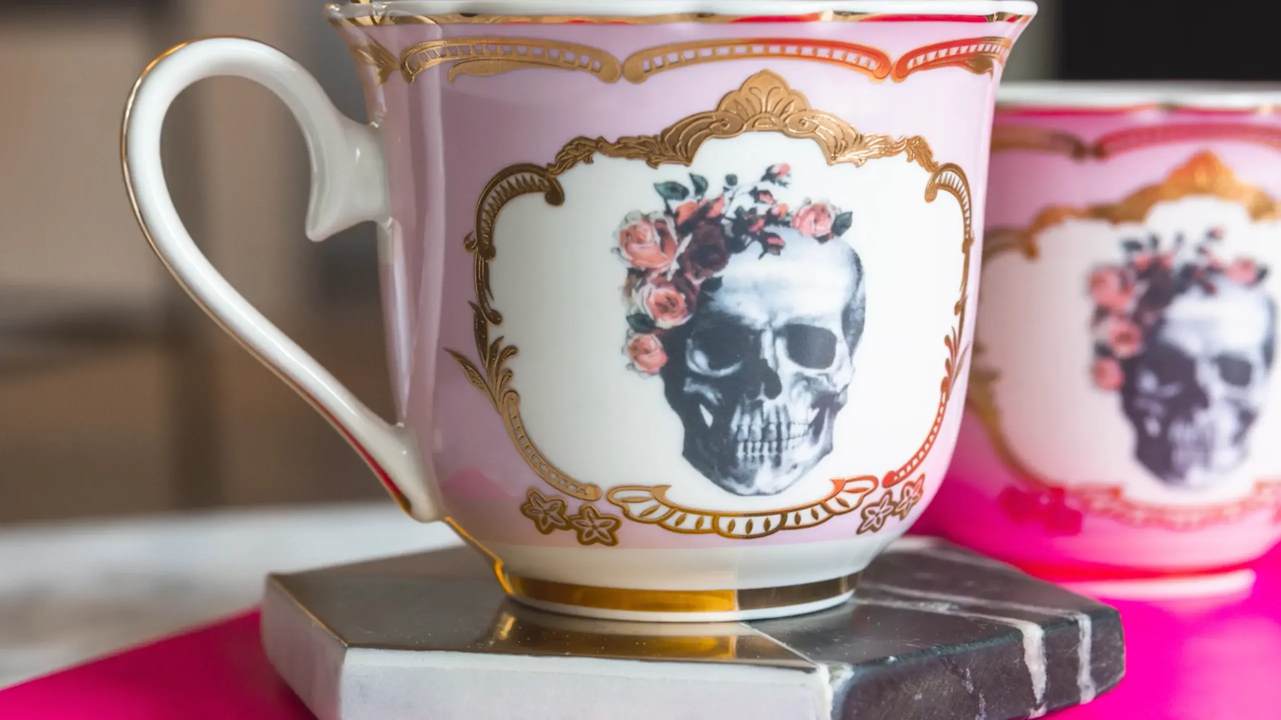 Image of tea cups with skulls adorned with flowers. Image of tea cups with skulls adorned with flowers.
